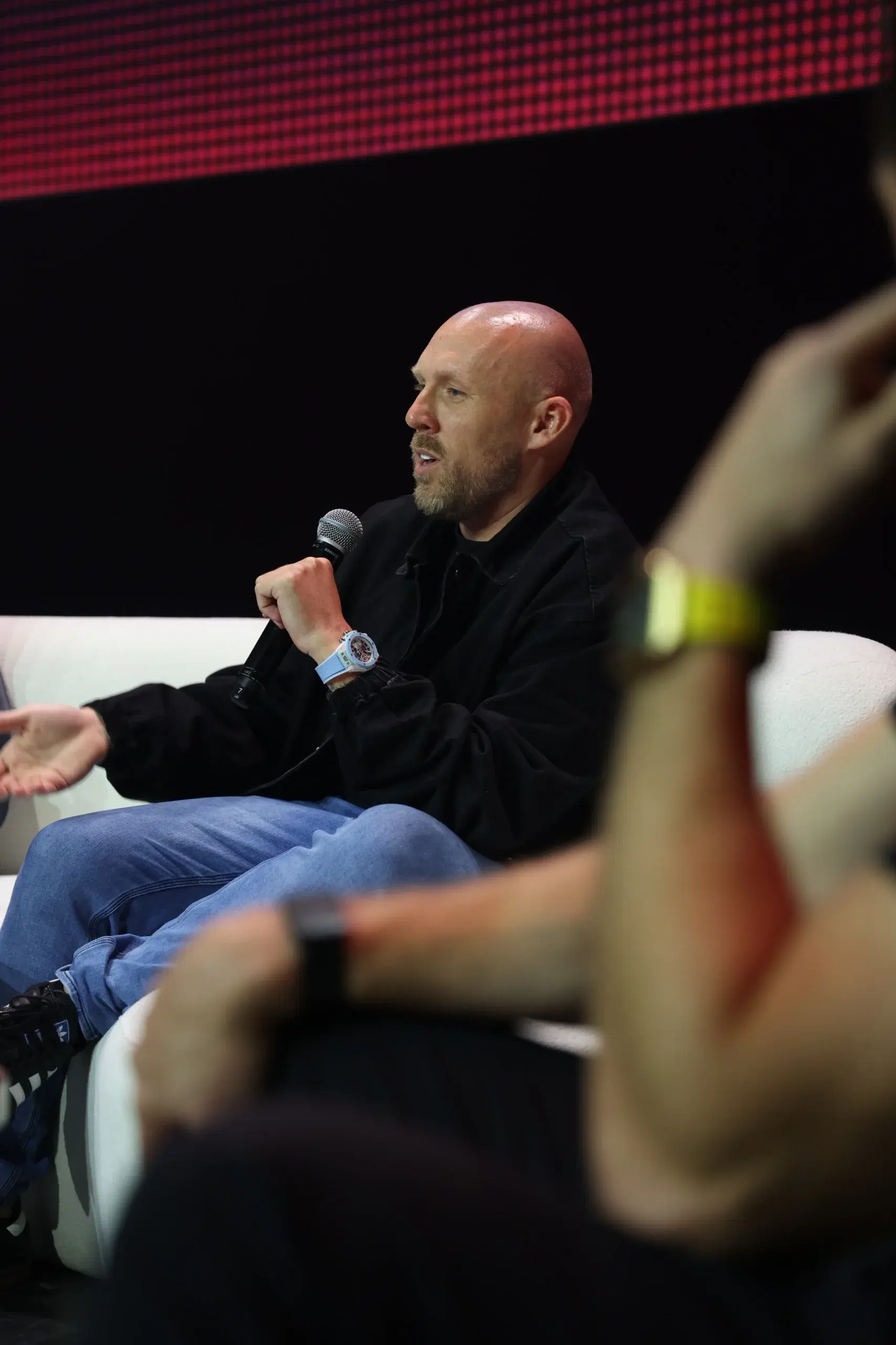 Joshua in conversation at a business event